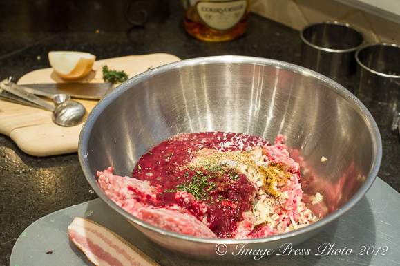 Add the spices and cognac to the raw meats