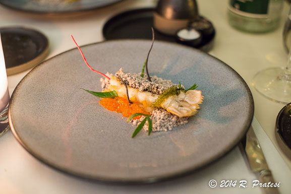 Roasted Langoustine with trout eggs, green curry cream, and popped wild quinoa