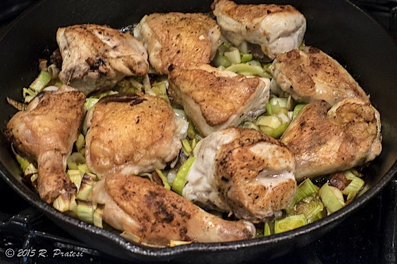 Place the chicken pieces on top of the leek mixture and then finish in the oven