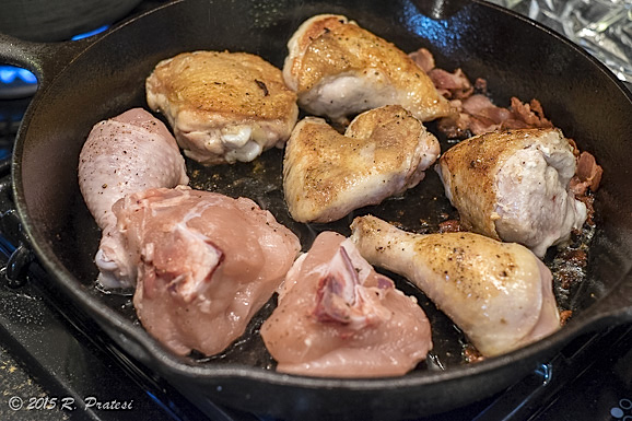 Sear chicken pieces in the bacon drippings