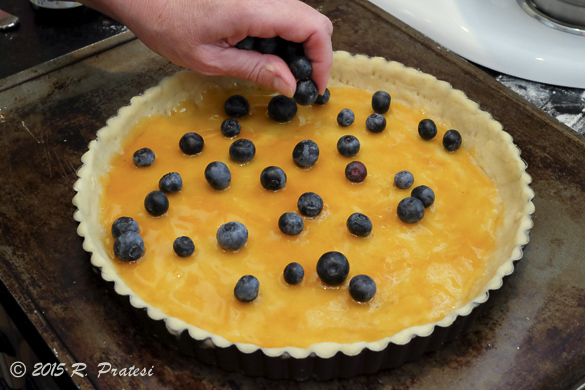 Sprinkle fresh blueberries evenly over the glazed shell