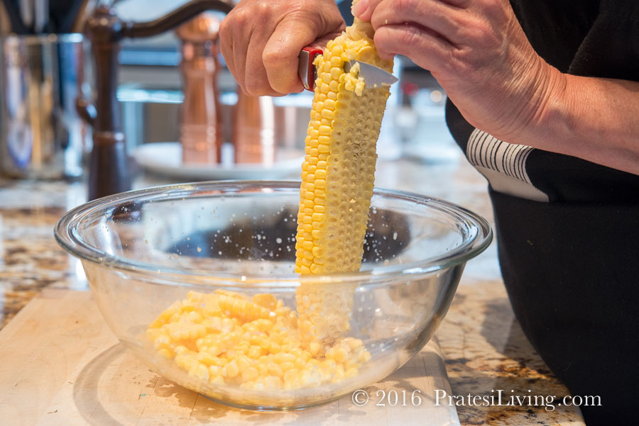 Scrape the milk from the cobs after cutting off the kernels and add to the pot